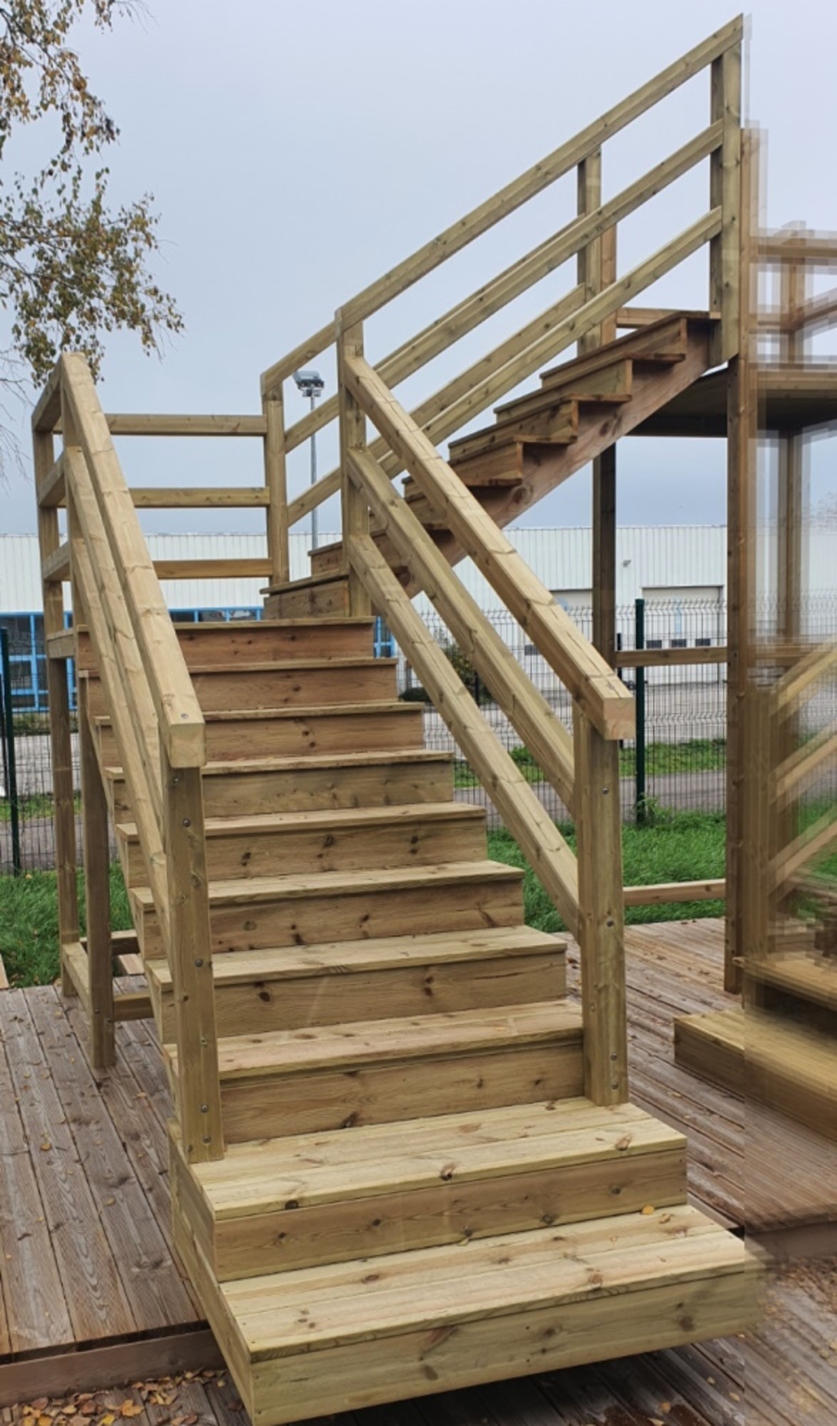 Deck stairs with landing and banisters