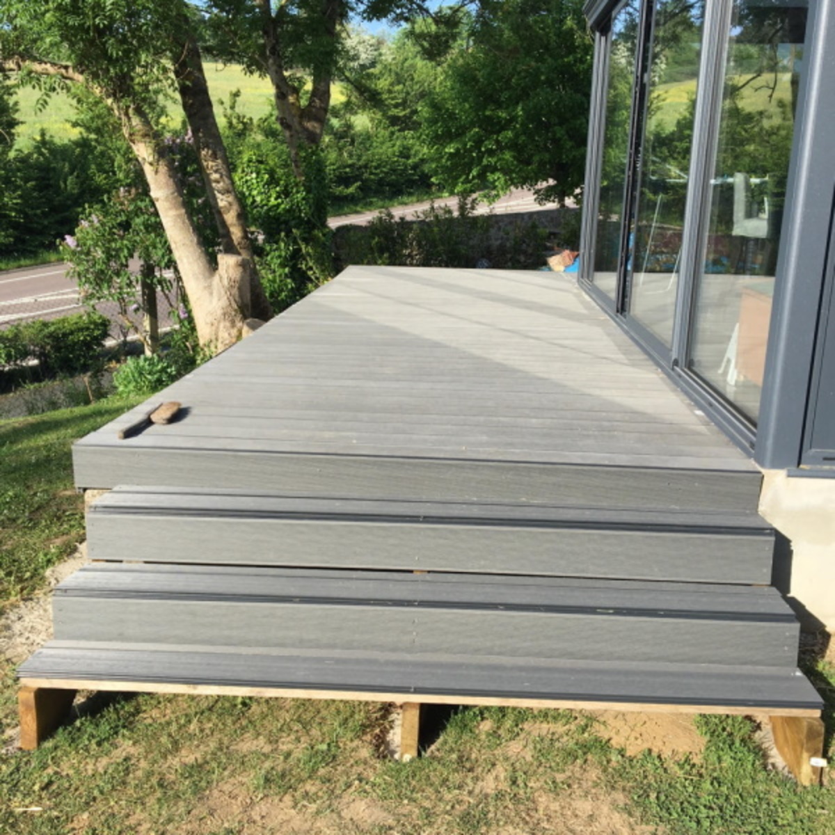 Wooden deck stair structure to support WPC composite steps
